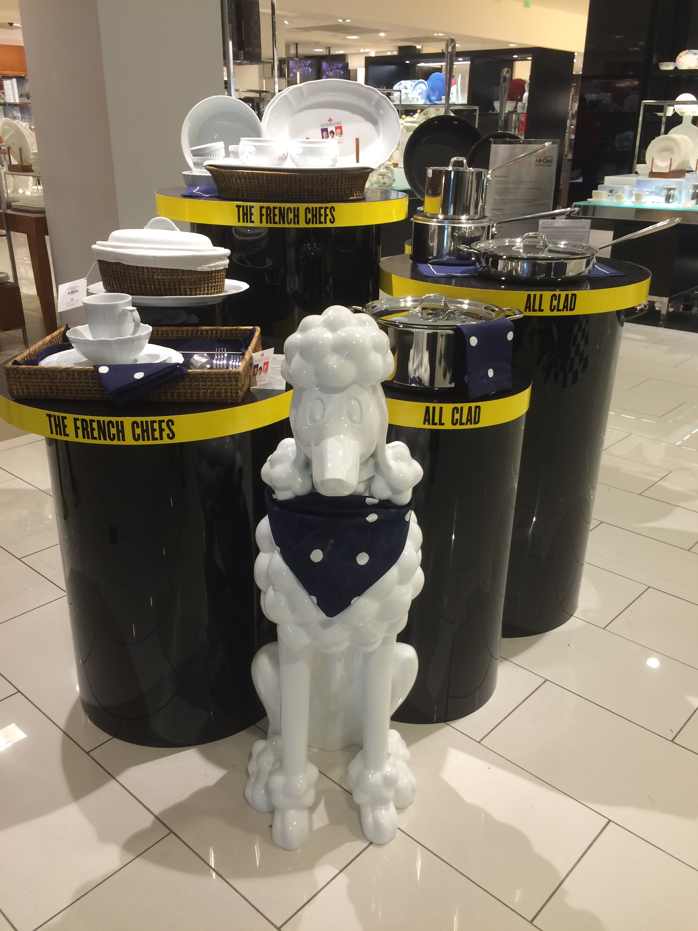 Huge White Ceramic Poodle In Front Of Cookware Display