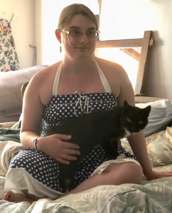 Woman Holding Tuxedo Cat