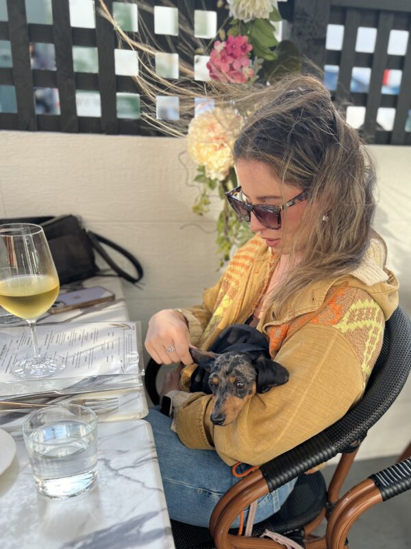 Woman Holding Dapple Miniature Dachshund Puppy