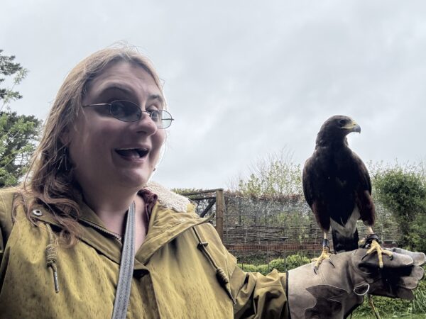 Hmm any tasty rodents around here... Woman Holding Red Kite Bird