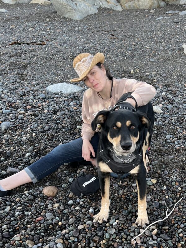 Hey! Are you flirtin' with my momma? Labrador Retriever Australian Cattle Dog Mix And Woman On Pebbly Beach