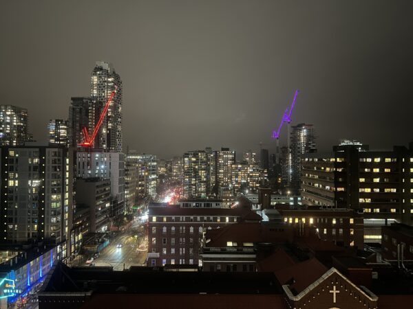 View With Two Lit Cranes In Vancouver, BC